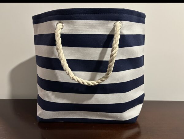 A blue and white striped canvas tote bag.