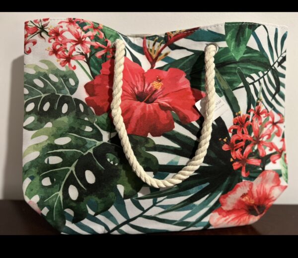 White tote bag with tropical flower print.